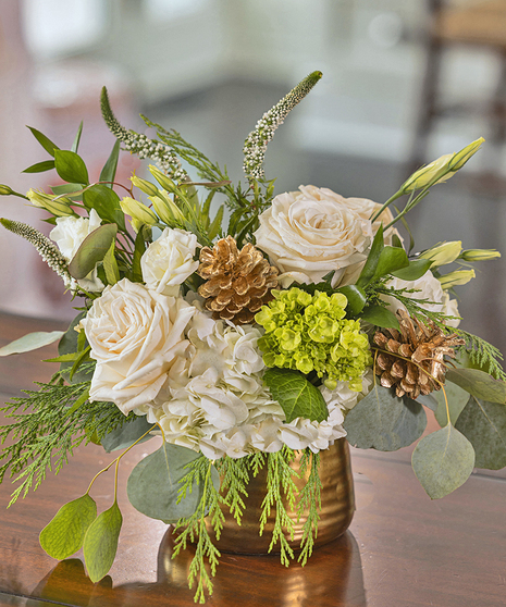 The Let it Snow Petite Arrangement featuring hydrangea, orchids and roses.