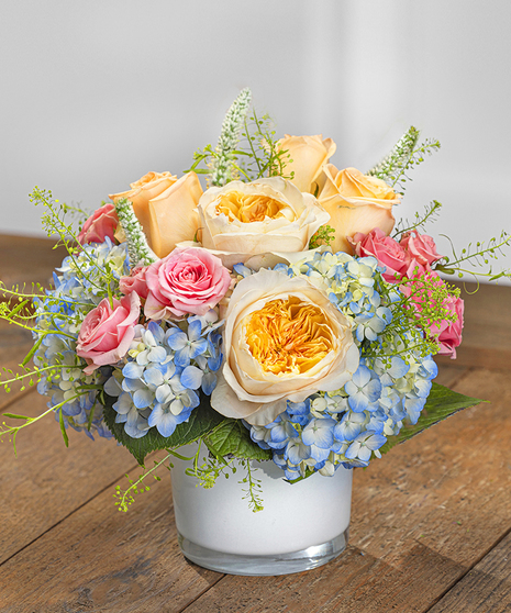 Southern Charm Centerpiece featuring hydrangea, roses and orchids