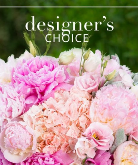 Custom floral arrangement in shades of pink, lavenders, and purple 