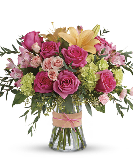 the Blush Life Arrangement featuring hydrangea, hot pink roses and lilies