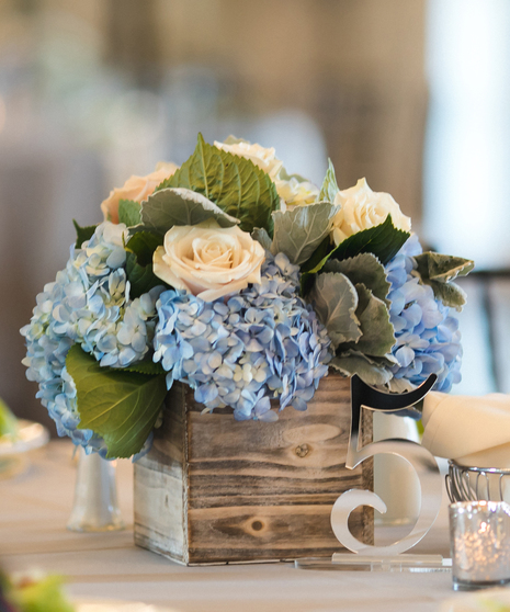 Blue and White Garden Centerpiece featuring hydrangea and roses by  Carithers Flowers Atlanta