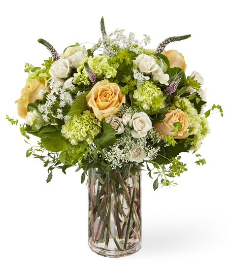Roses & Wildflowers bouquet features hydrangea, lavender veronica, queen anne's lace, peach and ivory roses.