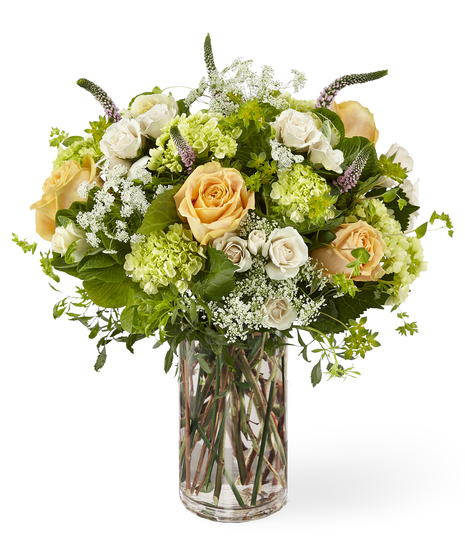Roses & Wildflowers bouquet features hydrangea, lavender veronica, queen anne's lace, peach and ivory roses.