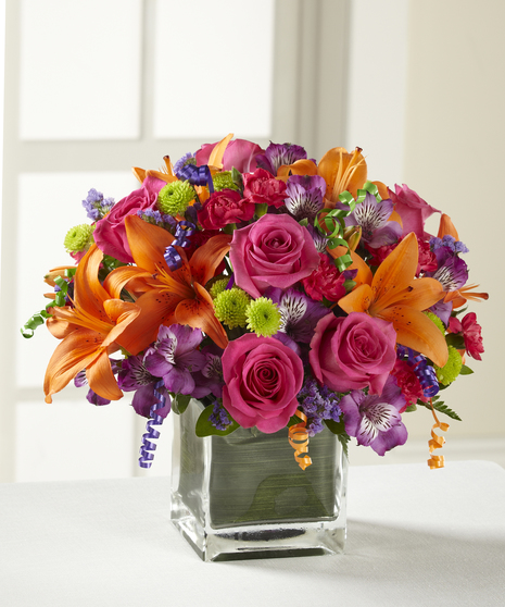 The Celebration Bouquet featuring lilies and roses