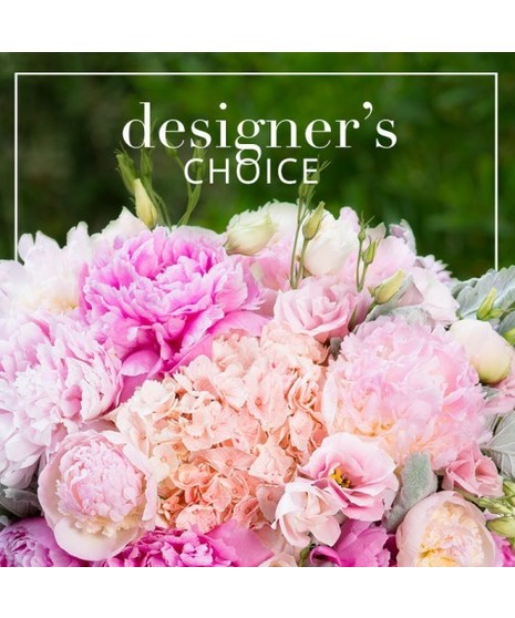 Custom floral arrangement in shades of pink, lavenders, and purple 