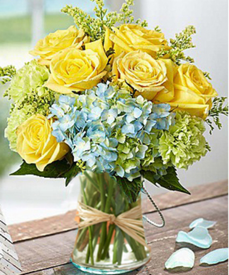Beautiful flower arrangement of hydrangea and roses by Carithers Flowers Atlanta