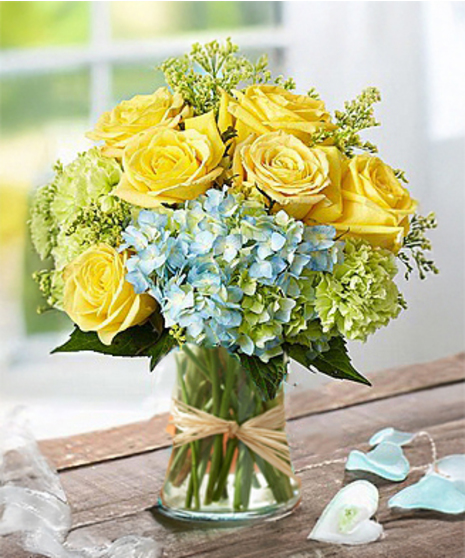 Beautiful flower arrangement of hydrangea and roses by Carithers Flowers Atlanta
