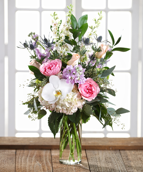 The Pastel Palette flower arrangement featuring hydrangea, roses and orchids.