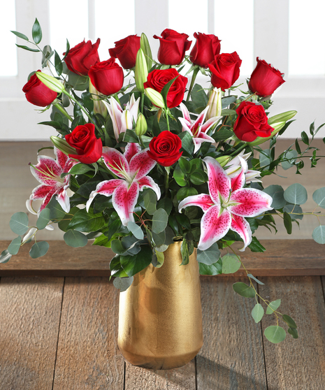 red roses and stargazer lilies flower arrangement