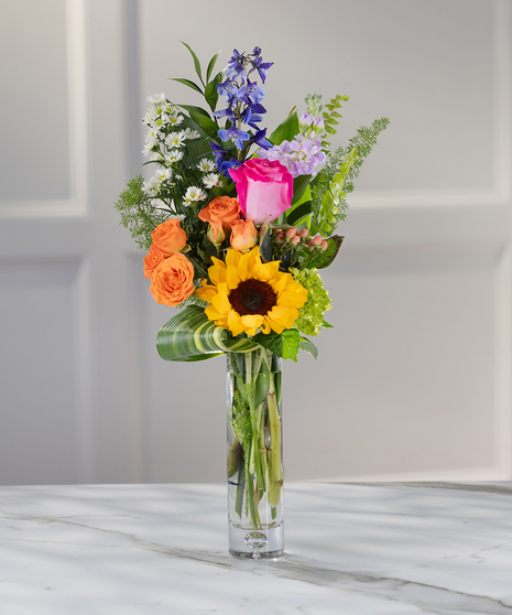Dutch Spring Floral Bunch Vase featuring roses, stock, sunflowers and lush foliage
