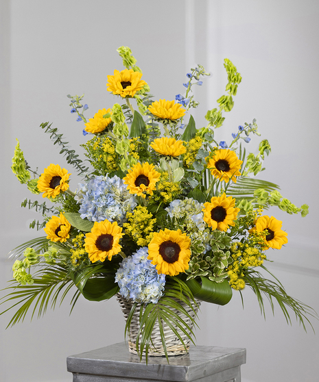 Sunflower Garden Sympathy Basket featuring sunflowers, hydrangea, and eucalyptus