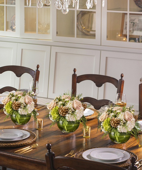 Winter Blush Bouquet featuring peach hydrangea, roses, magnolia, orchids and pepperberry
